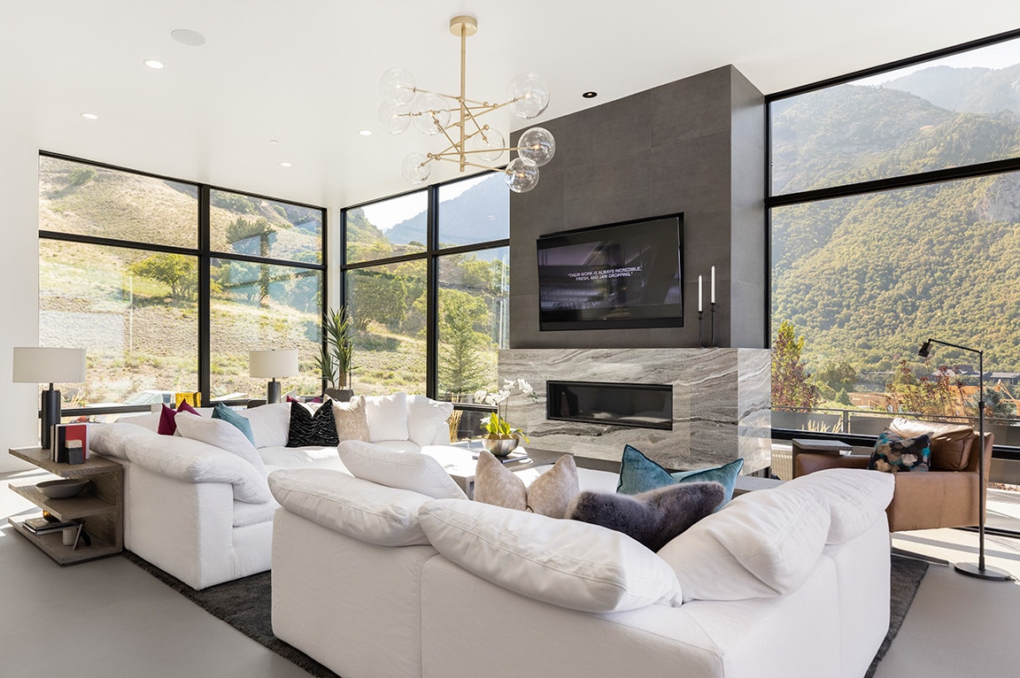 Floor-to-ceiling glass wall maximizing uninterrupted panoramic views of the Lagos lagoon from a luxury Ikoyi apartment.img